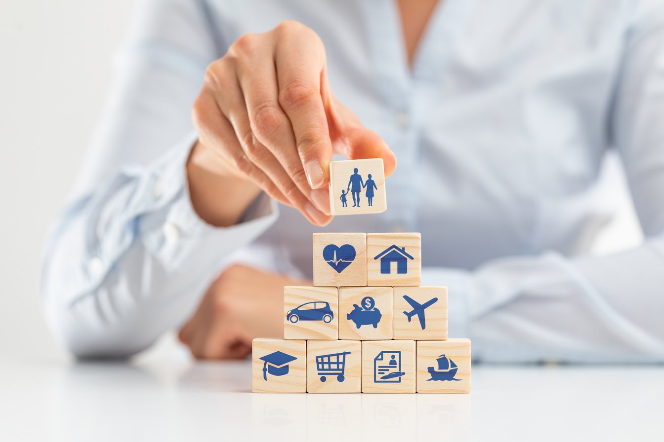 Person Placing Blocks On A Pyramid